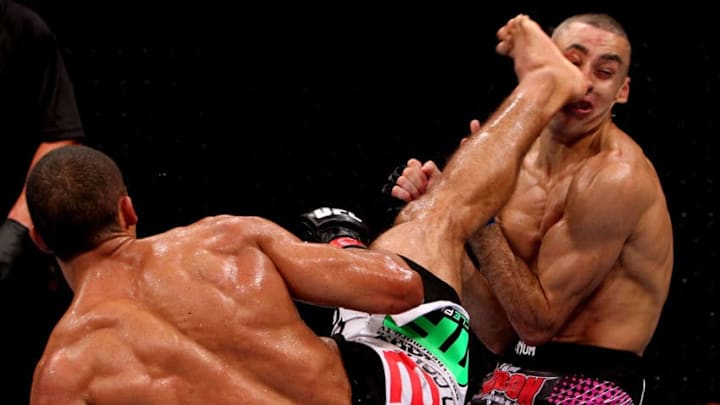 RIO DE JANEIRO, BRAZIL - JANUARY 14: Edson Barboza (L) knocks out Terry Etim (R) with a spinning back kick in a lightweight bout during UFC 142 at HSBC Arena on January 14, 2012 in Rio de Janeiro, Brazil. (Photo by Josh Hedges/Zuffa LLC/Zuffa LLC via Getty Images)