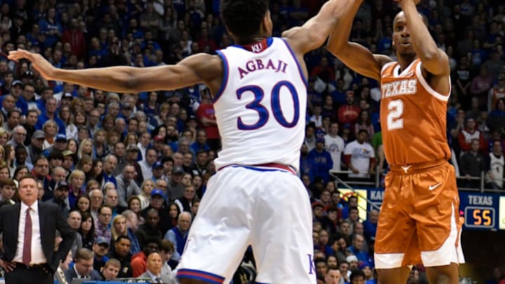 LAWRENCE, KANSAS – JANUARY 14: Matt Coleman III #2 of the Texas Longhorns shoots against Ochai Agbaji #30 of the Kansas Jayhawks in the second half at Allen Fieldhouse on January 14, 2019 in Lawrence, Kansas. (Photo by Ed Zurga/Getty Images)