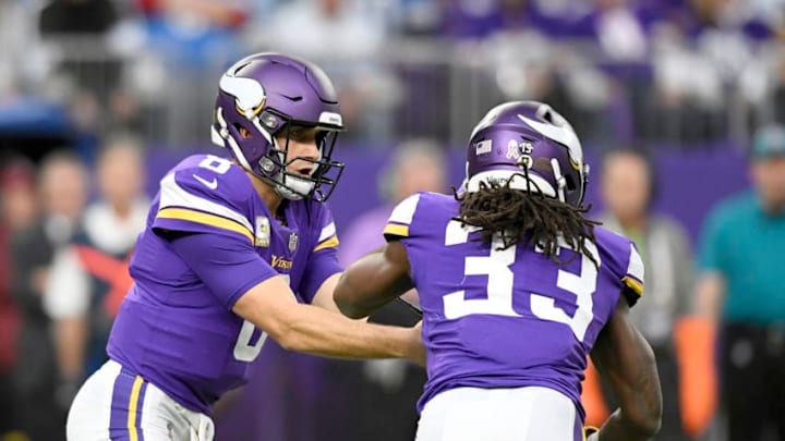 MINNEAPOLIS, MN - NOVEMBER 4: Kirk Cousins #8 of the Minnesota Vikings hands the ball off to teammate Dalvin Cook #33 in the second quarter of the game against the Detroit Lions at U.S. Bank Stadium on November 4, 2018 in Minneapolis, Minnesota. (Photo by Hannah Foslien/Getty Images)