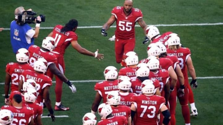 Dec 29, 2013; Phoenix, AZ, USA; Arizona Cardinals linebacker John Abraham (55) greets teammates prior to the game against the San Francisco 49ers at University of Phoenix Stadium. Mandatory Credit: Mark J. Rebilas-USA TODAY Sports
