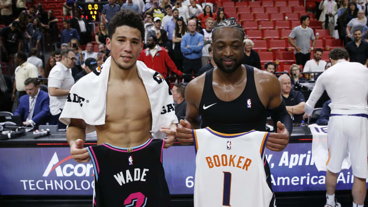 Devin Booker Dwyane Wade Phoenix Suns Miami Heat (Photo by Michael Reaves/Getty Images)
