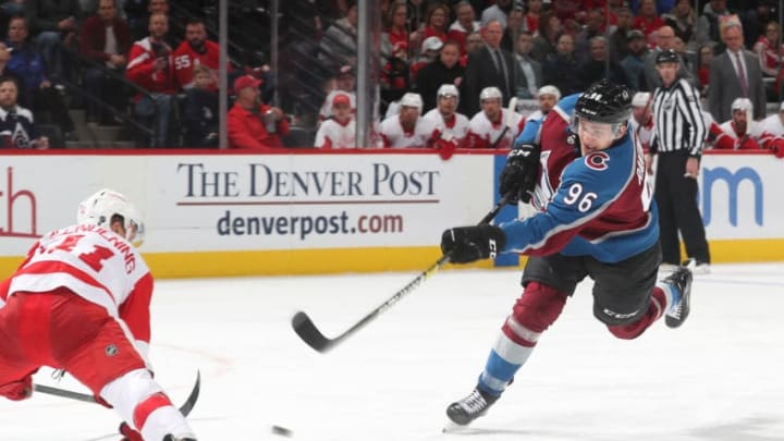 DENVER, CO - MARCH 5: Mikko Rantanen #96 of the Colorado Avalanche shoots against Luke Glendening #41"nof the Detroit Red Wings at the Pepsi Center on March 5, 2019 in Denver, Colorado. The Avalanche defeated the Red Wings 4-3 in overtime. (Photo by Michael Martin/NHLI via Getty Images)