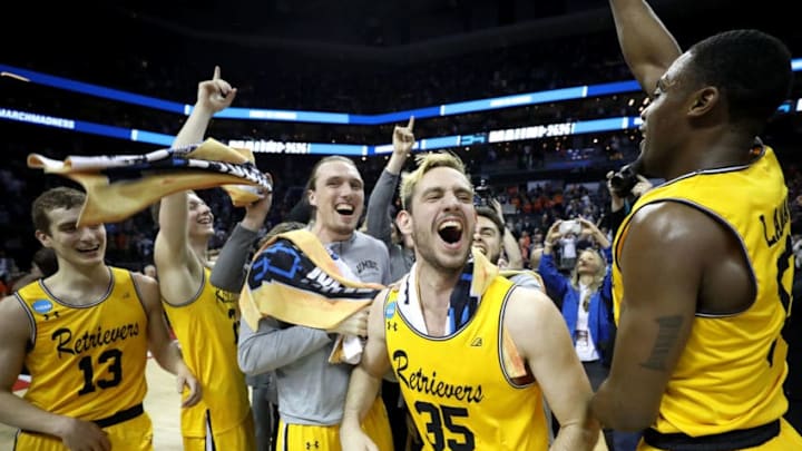 CHARLOTTE, NC - MARCH 16: The UMBC Retrievers bench reacts to their 74-54 victory over the Virginia Cavaliers during the first round of the 2018 NCAA Men's Basketball Tournament at Spectrum Center on March 16, 2018 in Charlotte, North Carolina. (Photo by Streeter Lecka/Getty Images)