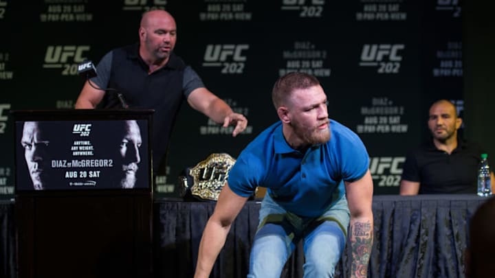 LAS VEGAS, NV - AUGUST 17: UFC featherweight champion Conor McGregor grabs two cans during the during the UFC 202 Press Conference at David Copperfield Theater in the MGM Grand Hotel/Casino on August 17, 2016 in Las Vegas, Nevada. (Photo by Brandon Magnus/Zuffa LLC/Zuffa LLC via Getty Images)