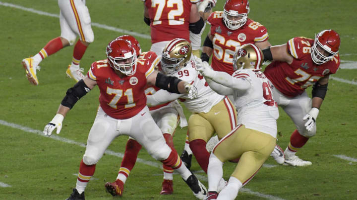 MIAMI, FLORIDA - FEBRUARY 02: Mitchell Schwartz #71 of the Kansas City Chiefs blocks Arik Armstead #91 of the San Francisco 49ers in Super Bowl LIV at Hard Rock Stadium on February 02, 2020 in Miami, Florida. The Chiefs won the game 31-20. (Photo by Focus on Sport/Getty Images)