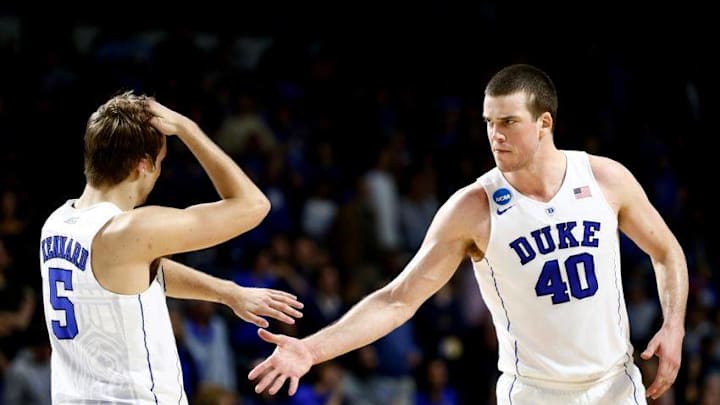 Mar 19, 2016; Providence, RI, USA; Duke Blue Devils guard Luke Kennard (5) and center Marshall Plumlee (40) celebrate after their victory over the Yale Bulldogs in a second round game of the 2016 NCAA Tournament at Dunkin Donuts Center. Duke won 71-64. Mandatory Credit: Mark L. Baer-USA TODAY Sports