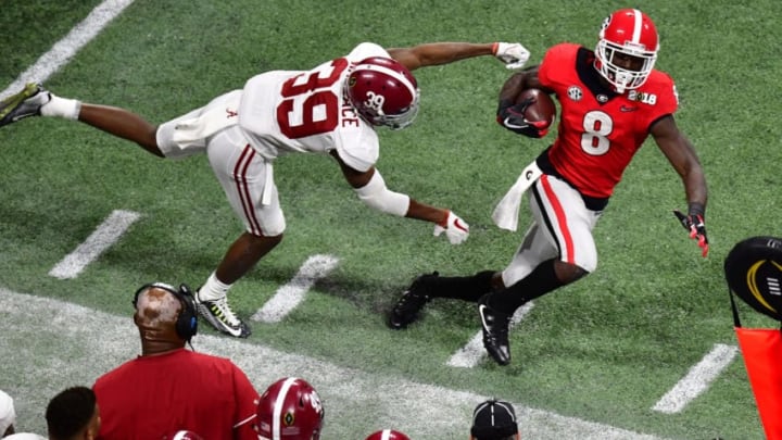 ATLANTA, GA - JANUARY 08: Riley Ridley #8 of the Georgia Bulldogs is forced out of bounds by Levi Wallace #39 of the Alabama Crimson Tide in the CFP National Championship presented by AT&T at Mercedes-Benz Stadium on January 8, 2018 in Atlanta, Georgia. (Photo by Scott Cunningham/Getty Images)