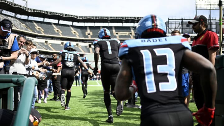 ARLINGTON, TX - MARCH 1: Freddie Martino #18, Jazz Ferguson #1, and Jeff Badet #13 of the Dallas Renegades run on to the field before the XFL game against the Houston Roughnecks at Globe Life Park on March 1, 2020 in Arlington, Texas. (Photo by Andrew Hancock/XFL via Getty Images)