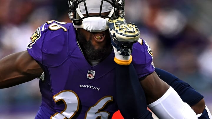 BALTIMORE, MD – NOVEMBER 30: Strong safety Matt Elam #26 of the Baltimore Ravens is kicked by wide receiver Eddie Royal #11 of the San Diego Chargers as they collide in the first half at M&T Bank Stadium on November 30, 2014 in Baltimore, Maryland. (Photo by Patrick Smith/Getty Images)