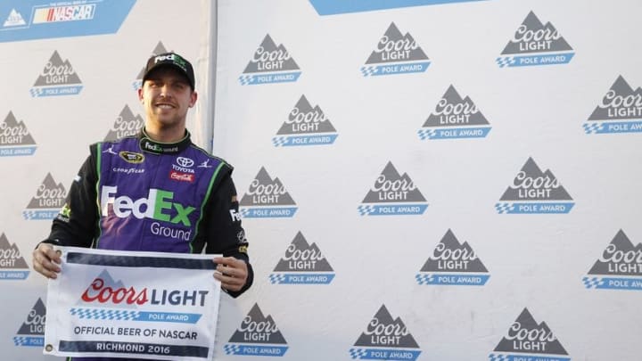 Sep 9, 2016; Richmond, VA, USA; Sprint Cup Series driver Denny Hamlin (11) poses for a photo after winning the pole award during qualifying for the Federated Auto Parts 400 at Richmond International Raceway. Mandatory Credit: Amber Searls-USA TODAY Sports