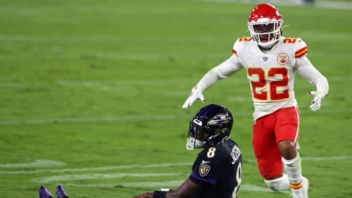 BALTIMORE, MARYLAND – SEPTEMBER 28: Lamar Jackson #8 of the Baltimore Ravens reacts after being knocked down in front of Juan Thornhill #22 of the Kansas City Chiefs at M&T Bank Stadium on September 28, 2020 in Baltimore, Maryland. (Photo by Todd Olszewski/Getty Images)