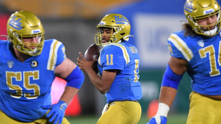 Dec 19, 2020; Pasadena, California, USA; UCLA Bruins quarterback Chase Griffin (11) sets to pass the ball during overtime against the Stanford Cardinal at the Rose Bowl. Mandatory Credit: Jayne Kamin-Oncea-USA TODAY Sports