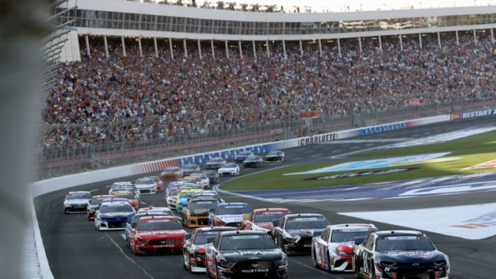 CHARLOTTE, NORTH CAROLINA - MAY 26: William Byron, driver of the #24 Liberty Patriotic Chevrolet, and Aric Almirola, driver of the #10 Smithfield Ford, lead the field into turn one after taking the green flag to start the Monster Energy NASCAR Cup Series Coca-Cola 600 at Charlotte Motor Speedway on May 26, 2019 in Charlotte, North Carolina. (Photo by Streeter Lecka/Getty Images)