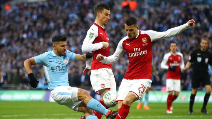 LONDON, ENGLAND - FEBRUARY 25: Sergio Aguero of Manchester City and Granit Xhaka of Arsenal compete for the ball during the Carabao Cup Final between Arsenal and Manchester City at Wembley Stadium on February 25, 2018 in London, England. (Photo by Julian Finney/Getty Images)