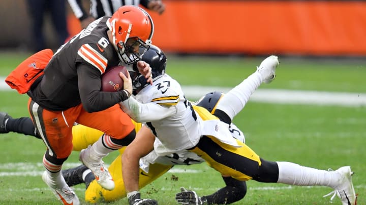 CLEVELAND, OHIO – JANUARY 03: Baker Mayfield #6 of the Cleveland Browns is tackled by Marcus Allen #27 of the Pittsburgh Steelers in the fourth quarter at FirstEnergy Stadium on January 03, 2021 in Cleveland, Ohio. (Photo by Jason Miller/Getty Images)