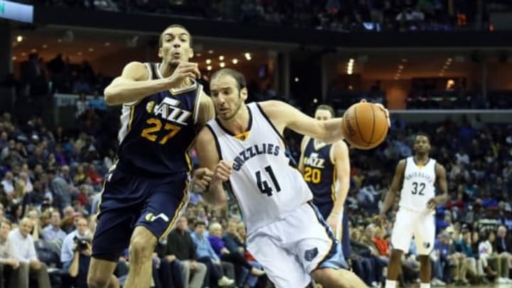 Mar 3, 2015; Memphis, TN, USA; Memphis Grizzlies center Kosta Koufos (41) drives to the basket against Utah Jazz center Rudy Gobert (27) during the second half at FedExForum. Utah defeated Memphis 93-82. Mandatory Credit: Nelson Chenault-USA TODAY Sports