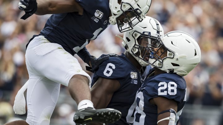 STATE COLLEGE, PA – AUGUST 31: Devyn Ford #28 of the Penn State Nittany Lions celebrates with KJ Hamler #1 and Justin Shorter #6 after scoring a touchdown against the Idaho Vandals during the first half at Beaver Stadium on August 31, 2019 in State College, Pennsylvania. (Photo by Scott Taetsch/Getty Images)