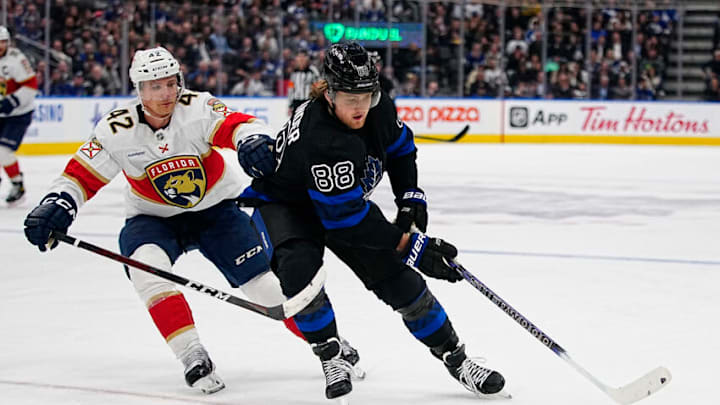 Mar 29, 2023; Toronto, Ontario, CAN; Toronto Maple Leafs forward William Nylander (88) tries to get around Florida Panthers defenseman Gustav Forsling (42) during the third period at Scotiabank Arena. Mandatory Credit: John E. Sokolowski-USA TODAY Sports