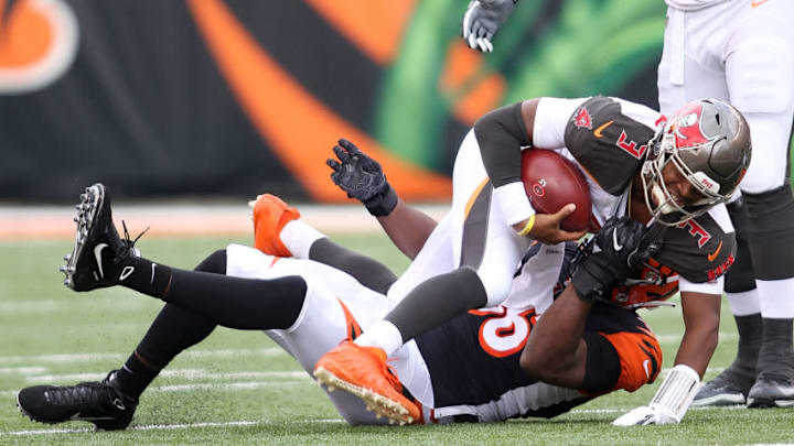 CINCINNATI, OH - OCTOBER 28: Carlos Dunlap #96 of the Cincinnati Bengals sacks Jameis Winston #3 of the Tampa Bay Buccaneers during the second quarter of the game at Paul Brown Stadium on October 28, 2018 in Cincinnati, Ohio. (Photo by John Grieshop/Getty Images)