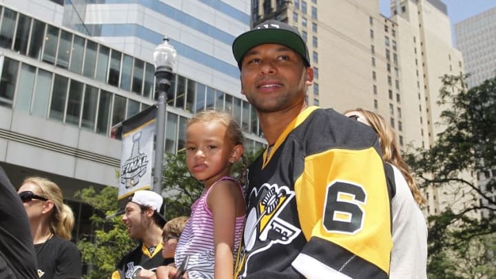 Jun 15, 2016; Pittsburgh, PA, USA; Pittsburgh Penguins defenseman Trevor Daley (6) and his family ride on a float during the Stanley Cup championship parade and celebration in downtown Pittsburgh. Mandatory Credit: Charles LeClaire-USA TODAY Sports