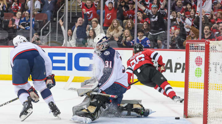 Apr 6, 2023; Newark, New Jersey, USA; New Jersey Devils center Jack Hughes (86) scores a goal past Columbus Blue Jackets goaltender Michael Hutchinson (31) during the first period at Prudential Center. Mandatory Credit: Vincent Carchietta-USA TODAY Sports