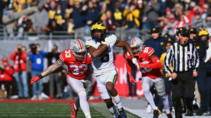 COLUMBUS, OHIO – NOVEMBER 26: Cornelius Johnson #6 of the Michigan Wolverines runs with the ball during the second quarter of a game against the Ohio State Buckeyes at Ohio Stadium on November 26, 2022 in Columbus, Ohio. (Photo by Ben Jackson/Getty Images)