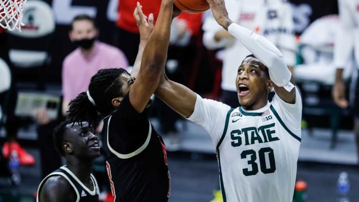 Michigan State forward Marcus Bingham Jr. makes a shot against Nebraska forward Derrick Walker during the first half at Breslin Center in East Lansing, Saturday, Feb. 6, 2021.