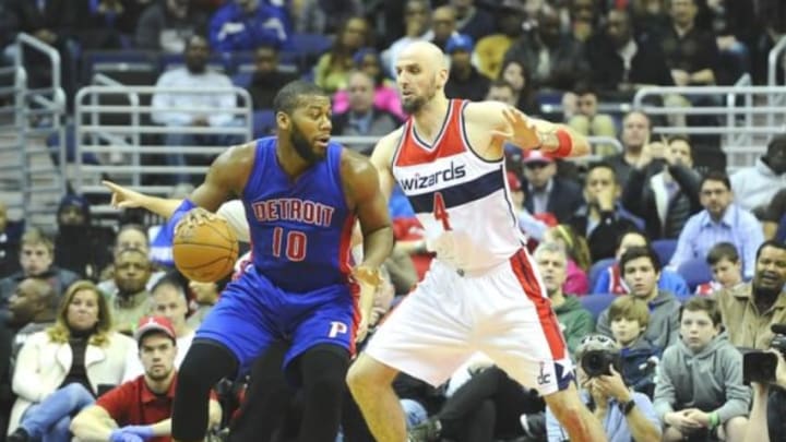 Feb 28, 2015; Washington, DC, USA; Detroit Pistons forward Greg Monroe (10) dribbles the ball as Washington Wizards center Marcin Gortat (4) defends during the first half at Verizon Center. Mandatory Credit: Brad Mills-USA TODAY Sports