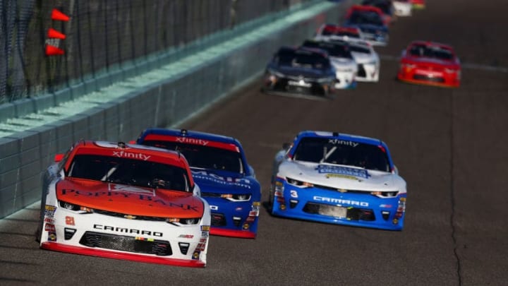 HOMESTEAD, FL - NOVEMBER 18: Daniel Hemric, driver of the #21 Poppy Bank Chevrolet, leads Elliott Sadler, driver of the #1 OneMain Financial Chevrolet, during the NASCAR XFINITY Series Championship Ford EcoBoost 300 at Homestead-Miami Speedway on November 18, 2017 in Homestead, Florida. (Photo by Sarah Crabill/Getty Images)