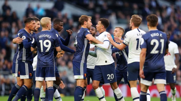 LONDON, ENGLAND - OCTOBER 19: Dele Alli of Tottenham Hotspur clashes with Craig Dawson of Watford during the Premier League match between Tottenham Hotspur and Watford FC at Tottenham Hotspur Stadium on October 19, 2019 in London, United Kingdom. (Photo by Catherine Ivill/Getty Images)