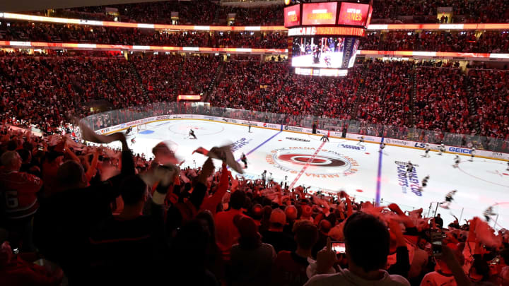 RALEIGH, NORTH CAROLINA – MAY 16: Carolina Hurricanes fans cheer prior to Game Four between the Boston Bruins and the Carolina Hurricanes in the Eastern Conference Finals during the 2019 NHL Stanley Cup Playoffs at PNC Arena on May 16, 2019 in Raleigh, North Carolina. (Photo by Grant Halverson/Getty Images)