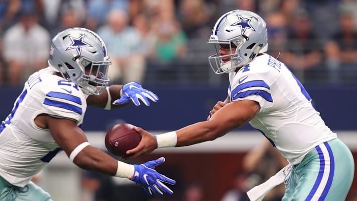 ARLINGTON, TX – SEPTEMBER 11: Dak Prescott #4 hands the ball to Ezekiel Elliott #21 of the Dallas Cowboys during the first quarter against the New York Giants at AT&T Stadium on September 11, 2016, in Arlington, Texas. (Photo by Tom Pennington/Getty Images)