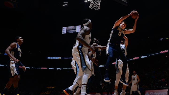 DENVER, CO - NOVEMBER 24: Nikola Jokic #15 of the Denver Nuggets grabs a rebound against the Memphis Grizzlies on November 24, 2017 at the Pepsi Center in Denver, Colorado. NOTE TO USER: User expressly acknowledges and agrees that, by downloading and/or using this photograph, user is consenting to the terms and conditions of the Getty Images License Agreement. Mandatory Copyright Notice: Copyright 2017 NBAE (Photo by Bart Young/NBAE via Getty Images)