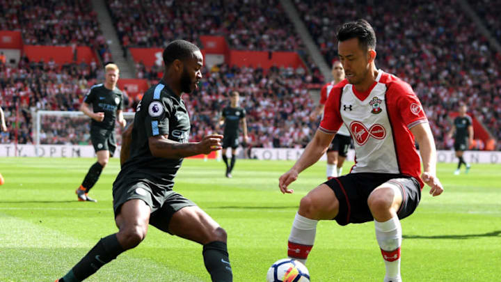 SOUTHAMPTON, ENGLAND - MAY 13: Raheem Sterling of Manchester City battles for possession with Maya Yoshida of Southampton during the Premier League match between Southampton and Manchester City at St Mary's Stadium on May 13, 2018 in Southampton, England. (Photo by Mike Hewitt/Getty Images)