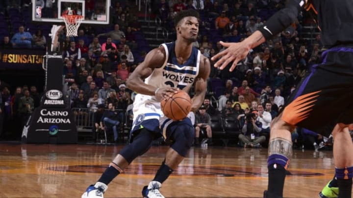 PHOENIX, AZ - DECEMBER 23: Jimmy Butler #23 of the Minnesota Timberwolves handles the ball against the Phoenix Suns on December 23, 2017 at Talking Stick Resort Arena in Phoenix, Arizona. NOTE TO USER: User expressly acknowledges and agrees that, by downloading and or using this photograph, user is consenting to the terms and conditions of the Getty Images License Agreement. Mandatory Copyright Notice: Copyright 2017 NBAE (Photo by Michael Gonzales/NBAE via Getty Images)