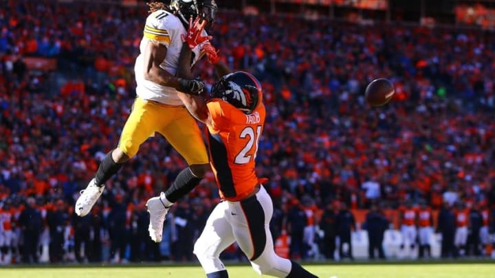 Jan 17, 2016; Denver, CO, USA; Pittsburgh Steelers wide receiver Markus Wheaton (11) attempts to catch a pass against Denver Broncos cornerback Aqib Talib (21) during the AFC Divisional round playoff game at Sports Authority Field at Mile High. Mandatory Credit: Mark J. Rebilas-USA TODAY Sports
