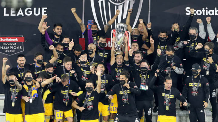 The Tigres celebrate with the Concacaf Champions League trophy in Orlando, Florida, after their 2-1 win over LAFC. (Photo by Alex Menendez/Getty Images)