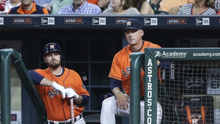 Apr 22, 2016; Houston, TX, USA; Houston Astros first baseman Tyler White (13) and manager A.J. Hinch (14) watch from the dugout during the sixth inning against the Boston Red Sox at Minute Maid Park. Mandatory Credit: Troy Taormina-USA TODAY Sports