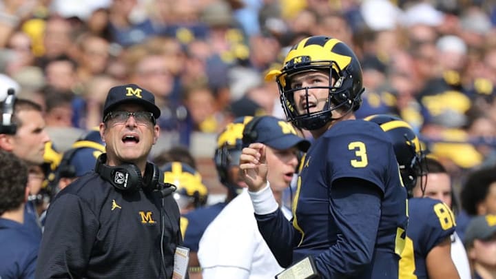 ANN ARBOR, MI - SEPTEMBER 16: Michigan Wolverines head football coach Jim Harbaugh and starting quarterback Wilton Speight #3 watch the video replay during the first quarter of the game against the Air Force Falcons at Michigan Stadium on September 16, 2017 in Ann Arbor, Michigan.(Photo by Leon Halip/Getty Images)