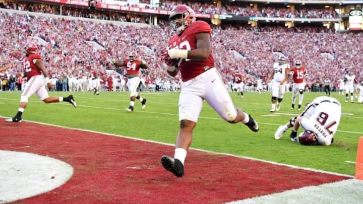 Oct 22, 2016; Tuscaloosa, AL, USA; Alabama Crimson Tide defensive lineman Jonathan Allen (93) returns a fumble for a touchdown against the Texas A&M Aggies during the third quarter at Bryant-Denny Stadium. Mandatory Credit: John David Mercer-USA TODAY Sports