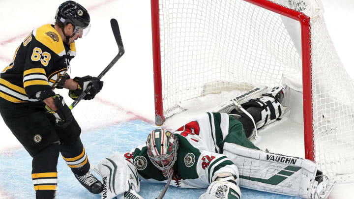 BOSTON - NOVEMBER 23: Minnesota Wild goaltender Alex Stalock (32) covers up the rebound after denying Boston Bruins center Brad Marchand (63) and Boston Bruins defenseman Charlie McAvoy (73) on a two on none breakaway during the first period. The Boston Bruins host the Minnesota Wild in a regular season NHL hockey game at TD Garden in Boston on Nov. 23, 2019. (Photo by Barry Chin/The Boston Globe via Getty Images)