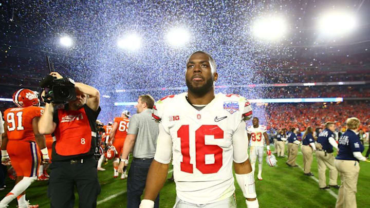 Dec 31, 2016; Glendale, AZ, USA; Ohio State Buckeyes quarterback J.T. Barrett (16) walks off the field after the 2016 CFP semifinal against the Clemson Tigers at University of Phoenix Stadium. The Clemson Tigers wont 31-0. Mandatory Credit: Mark J. Rebilas-USA TODAY Sports
