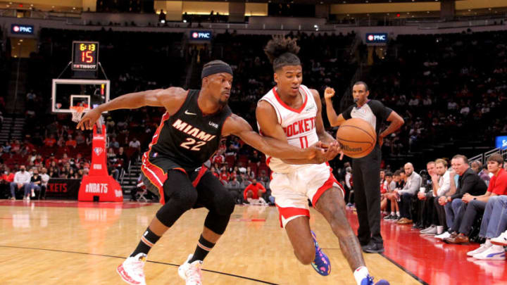 Miami Heat forward Jimmy Butler (22) and Houston Rockets guard Jalen Green (0) pursue a loose ball (Mandatory Credit: Erik Williams-USA TODAY Sports)