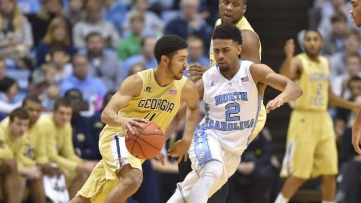 Jan 2, 2016; Chapel Hill, NC, USA; Georgia Tech Yellow Jackets guard Josh Heath (11) dribbles as North Carolina Tar Heels guard Joel Berry II (2) defends in the second half. The Tar Heels defeated the Yellow Jackets 86-78 at Dean E. Smith Center. Mandatory Credit: Bob Donnan-USA TODAY Sports