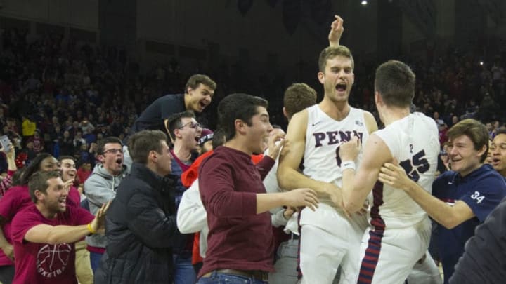 PHILADELPHIA, PA - DECEMBER 11: AJ Brodeur #25 and Max Rothschild #0 of the Pennsylvania Quakers celebrate their win against the Villanova Wildcats at The Palestra on December 11, 2018 in Philadelphia, Pennsylvania. The Quakers defeated the Wildcats 78-75. (Photo by Mitchell Leff/Getty Images)
