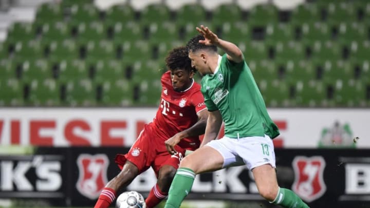 Kingsley Coman, Bayern Munich and Milos Veljkovic, Werder Bremen.  (Photo by MARTIN MEISSNER/POOL/AFP via Getty Images)