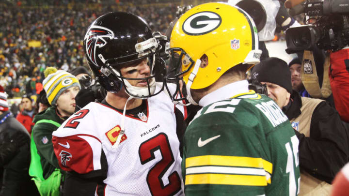 GREEN BAY, WI - DECEMBER 08: Matt Ryan #2 of the Atlanta Falcons and Aaron Rodgers #12 of the Green Bay Packers talk after the Packers defeated the Falcons 43 to 37 at Lambeau Field on December 8, 2014 in Green Bay, Wisconsin. (Photo by Mike McGinnis/Getty Images)