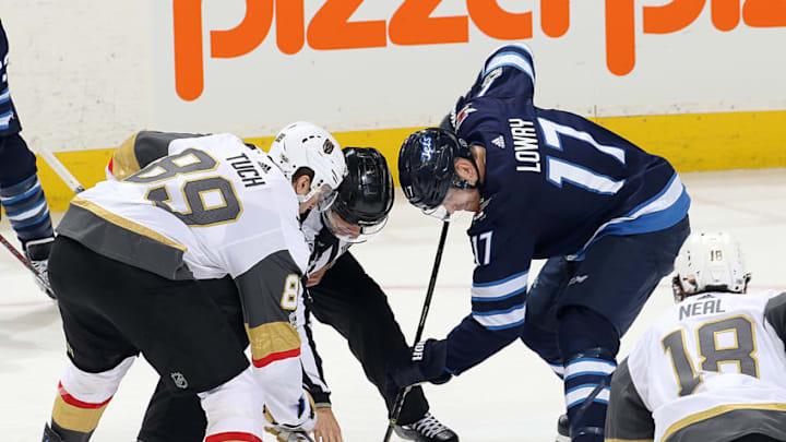 WINNIPEG, MB - DECEMBER 1: Alex Tuch #89 of the Vegas Golden Knights wins a third period face-off against Adam Lowry #17 of the Winnipeg Jets at the Bell MTS Place on December 1, 2017 in Winnipeg, Manitoba, Canada. (Photo by Jonathan Kozub/NHLI via Getty Images)