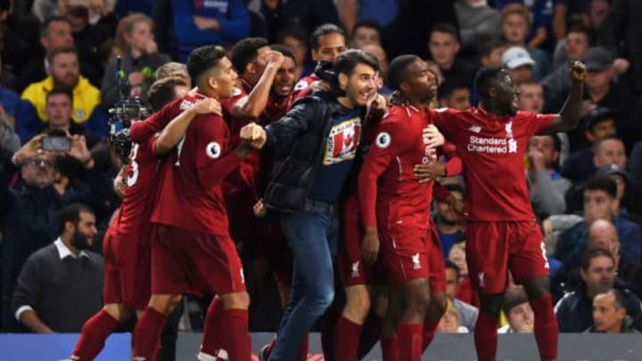 LONDON, ENGLAND – SEPTEMBER 29: A pitch invader joins in as Daniel Sturridge of Liverpool celebrates with teammates after scoring the equalising goal during the Premier League match between Chelsea FC and Liverpool FC at Stamford Bridge on September 29, 2018 in London, United Kingdom. (Photo by Mike Hewitt/Getty Images)