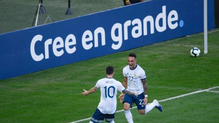 Argentina's Lautaro Martinez (R) celebrates with teammate Lionel Messi after scoring against Venezuela during their Copa America football tournament quarter-final match at Maracana Stadium in Rio de Janeiro, Brazil, on June 28, 2019. (Photo by Mauro PIMENTEL / AFP) (Photo credit should read MAURO PIMENTEL/AFP via Getty Images)